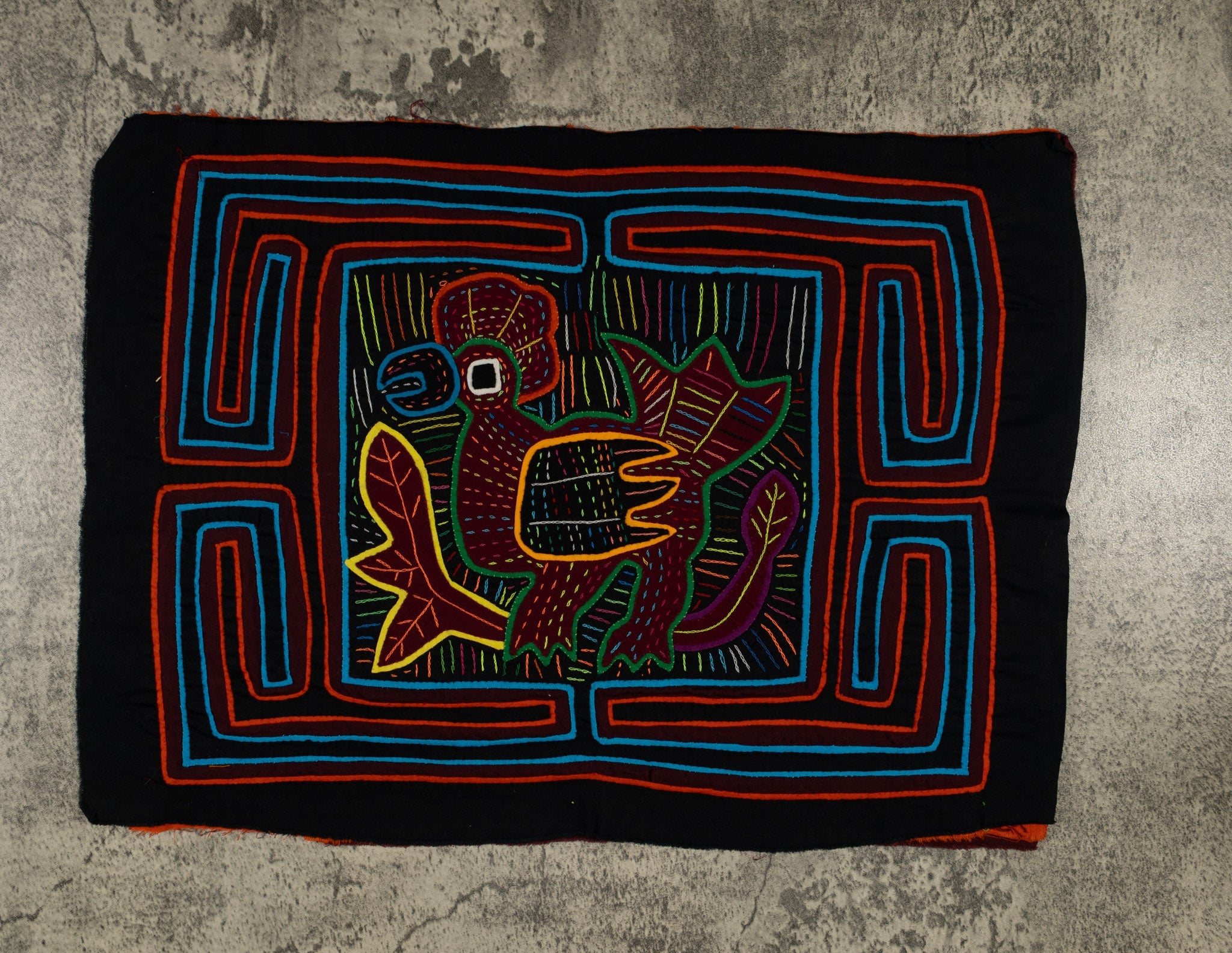 Traditional Red Orange And Blue Rainforest Bird Mola