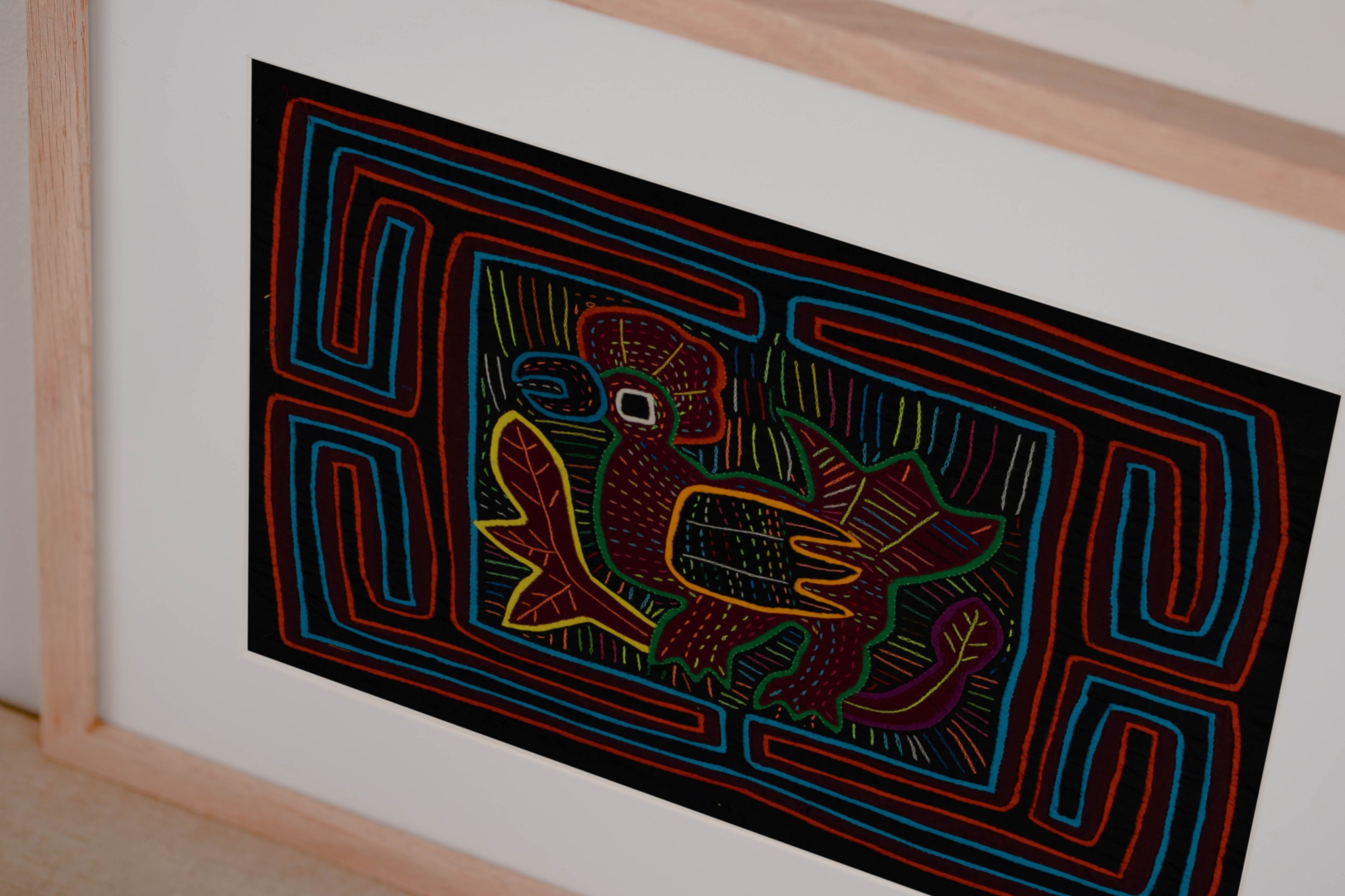 Traditional Red Orange And Blue Rainforest Bird Mola