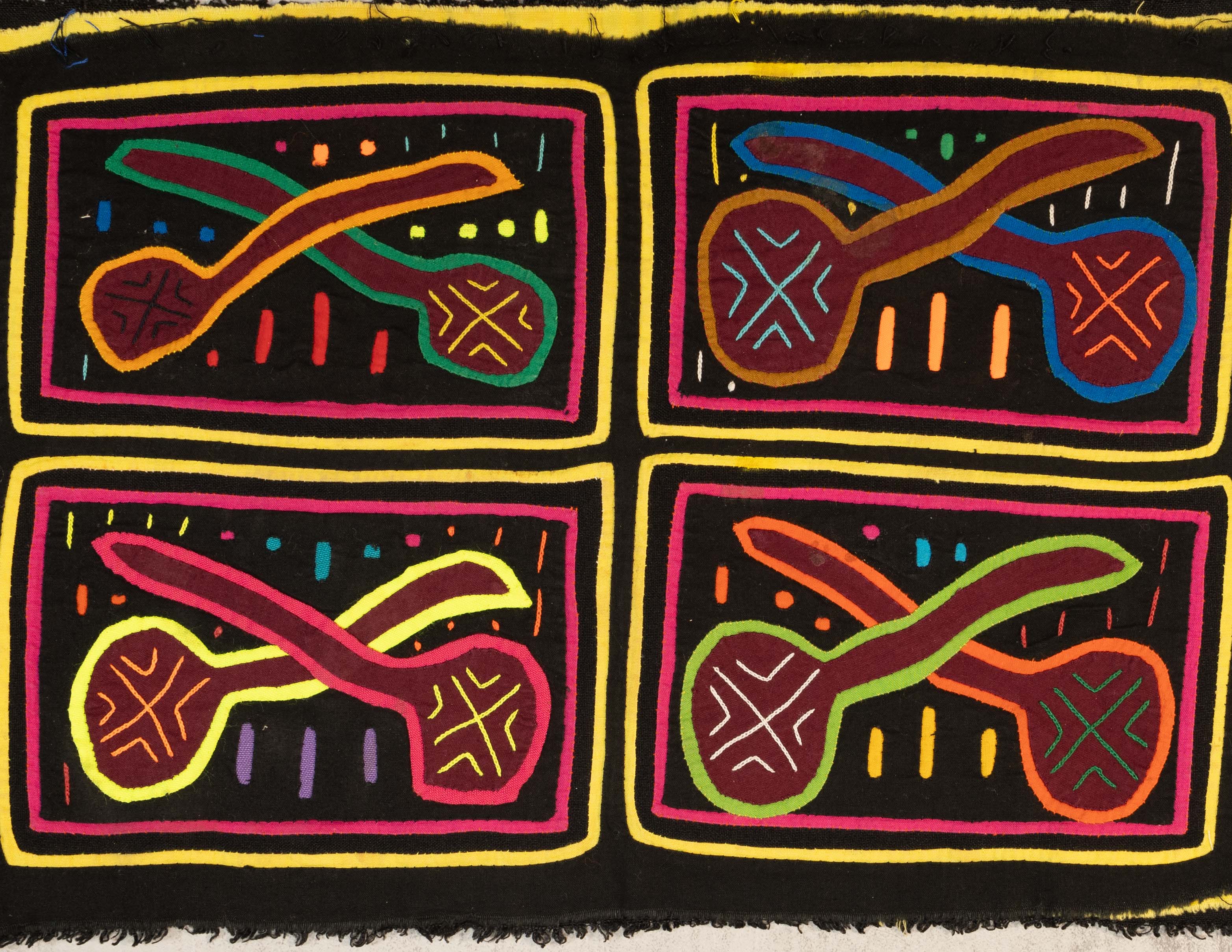 Black And Yellow Pipe Or Maraca Mola