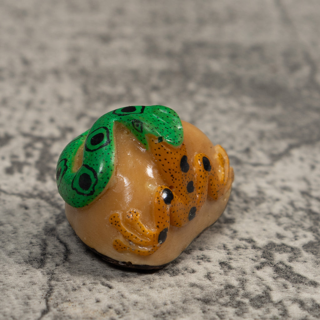 Green And Gold Snake Eating Frog Tagua Carving