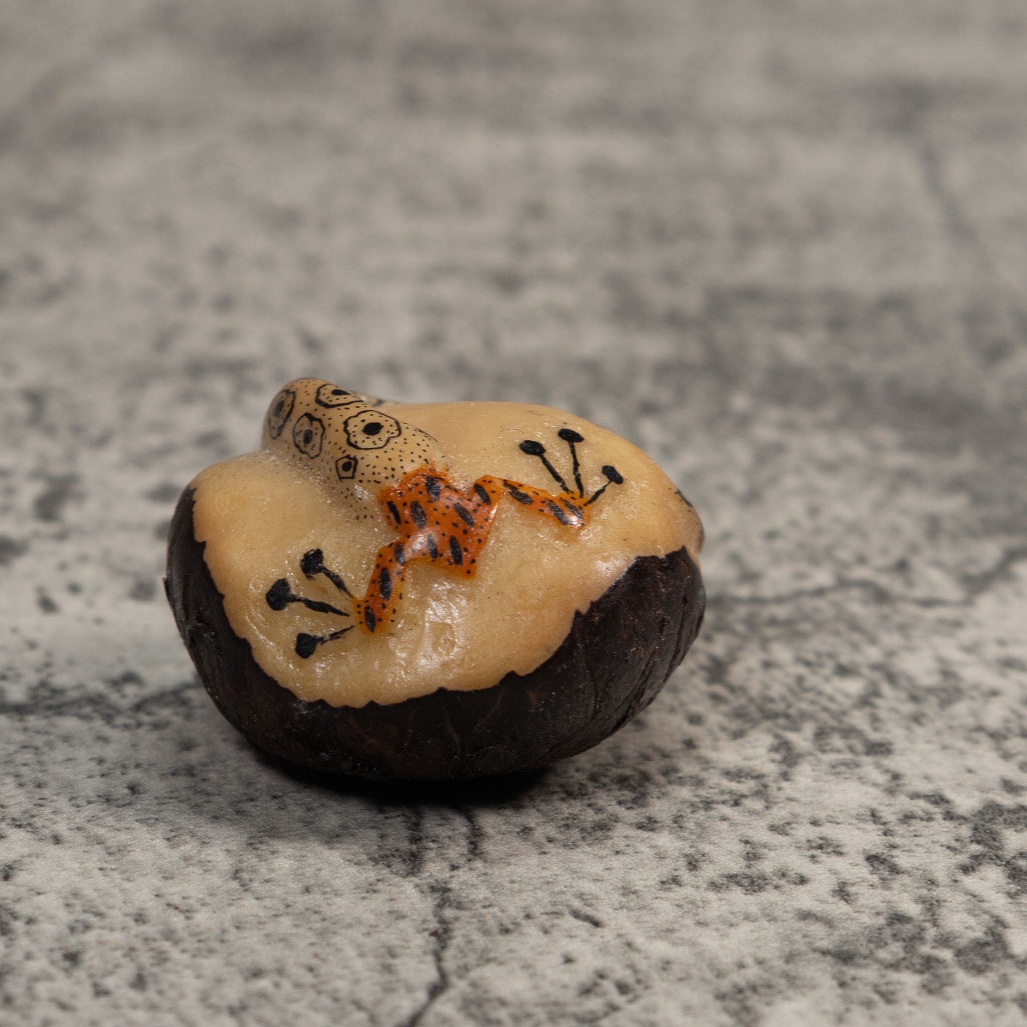 Orange And Black Snake Eating Frog Tagua Carving